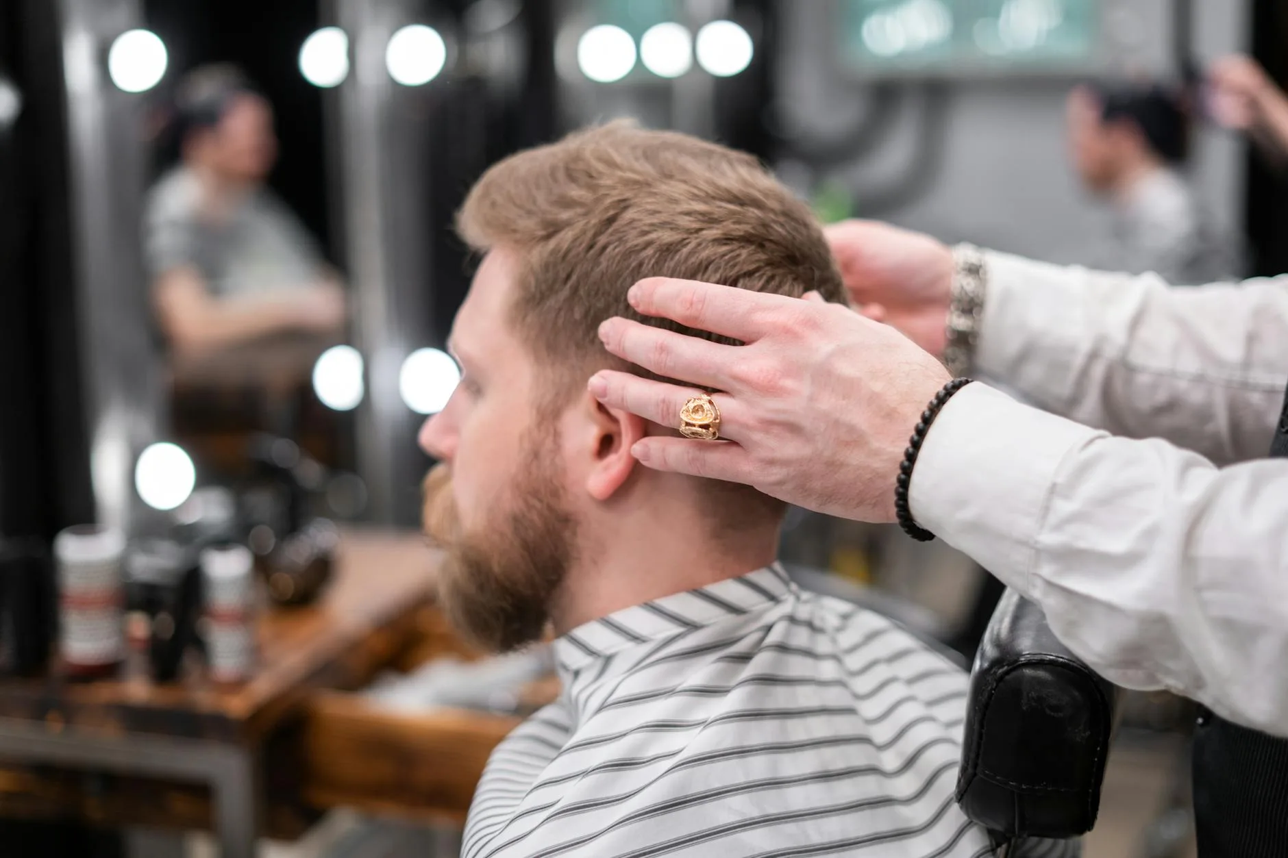 photo of a barber giving a haircut