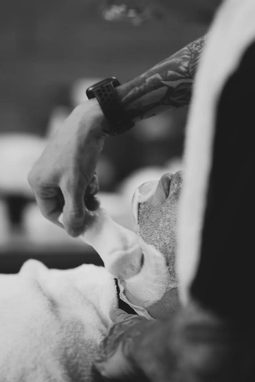 crop client in salon during shaving procedure