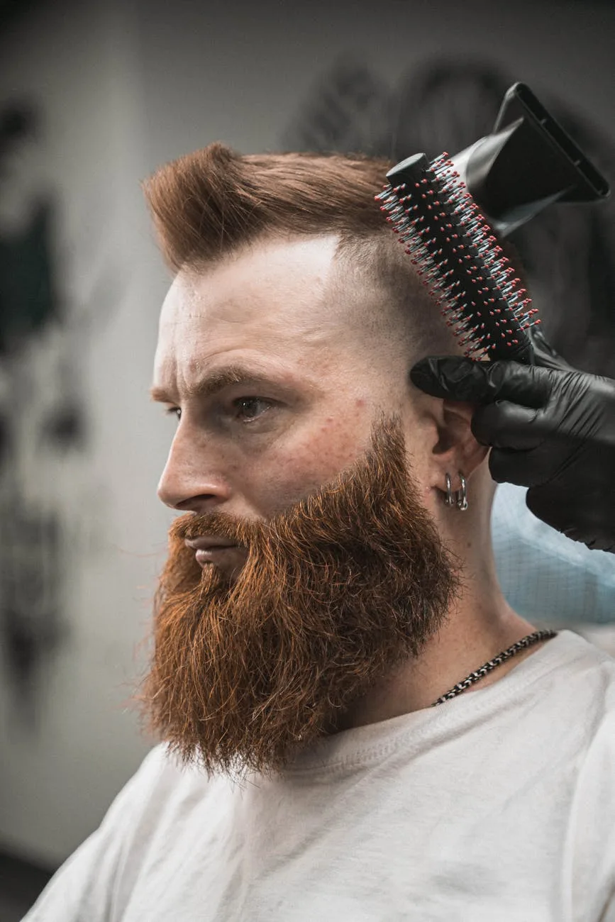 bearded man having a haircut