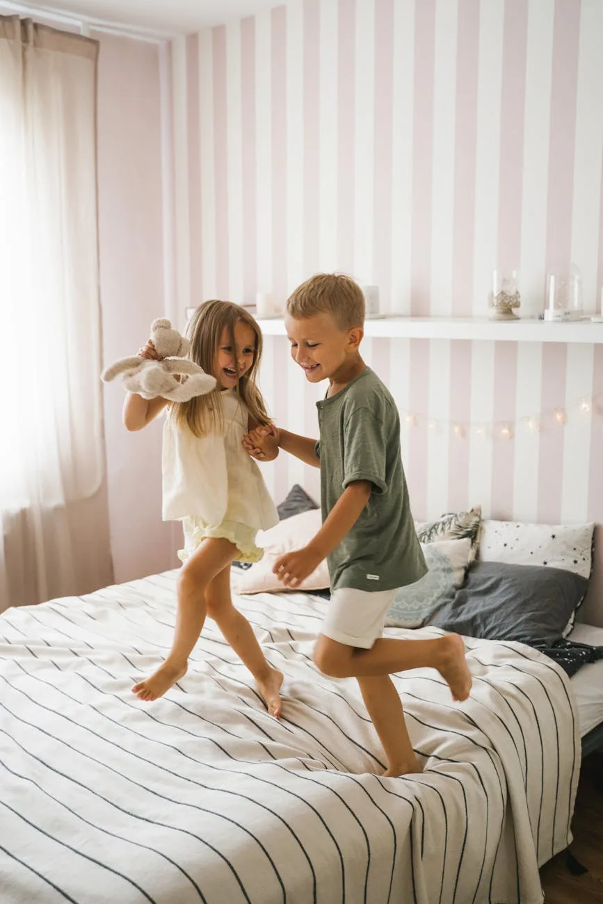 a happy boy and girl dancing on the bed